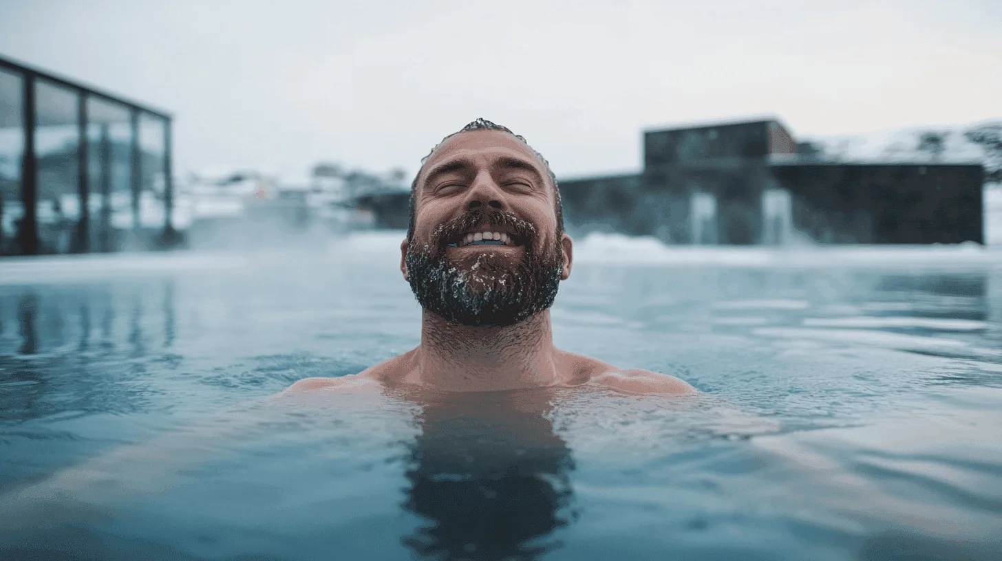 Swimmers beside steaming hot tubs at Nauthólsvík beach in winter